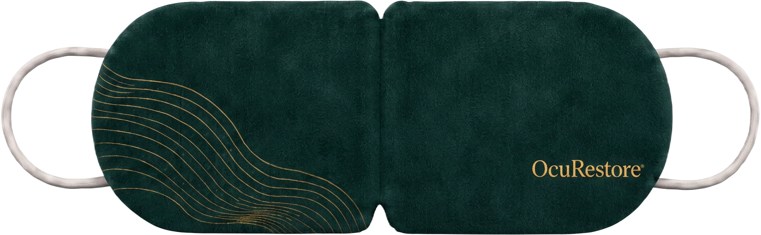 The OcuRestore self-heating eye mask in deep forest green with gold contour detailing and soft ear loops